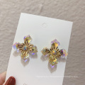 Shangjie oem aretes al por mayor de la moda bling aretes de encanto púrpura aretes de cristal amarillo pendientes de flores